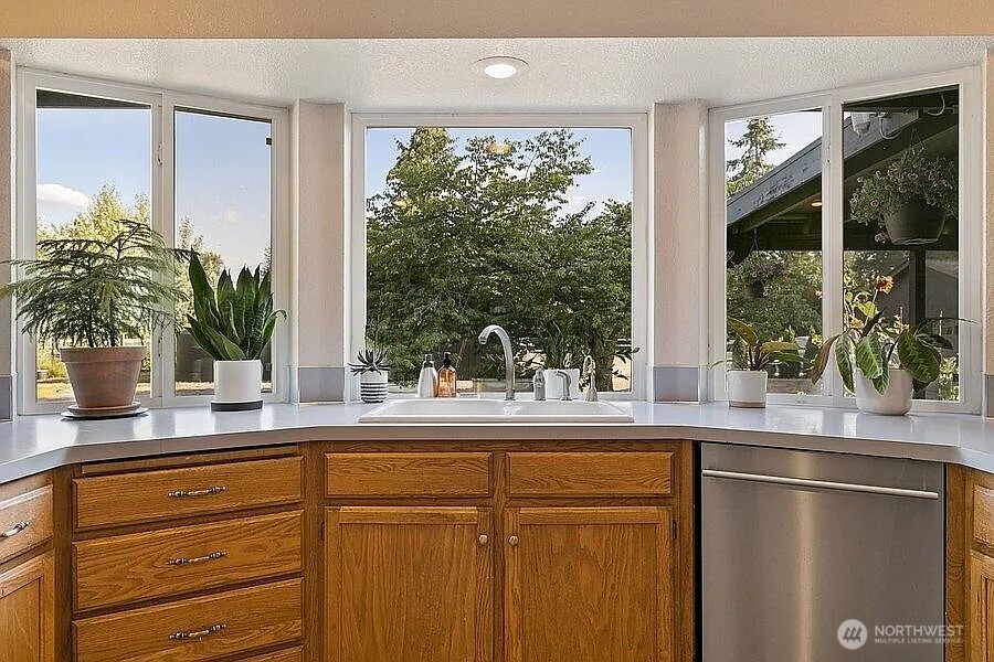Undisclosed Address Redmond, WA 98052 - Photo 6 of 31 a kitchen with a window a sink and cabinets