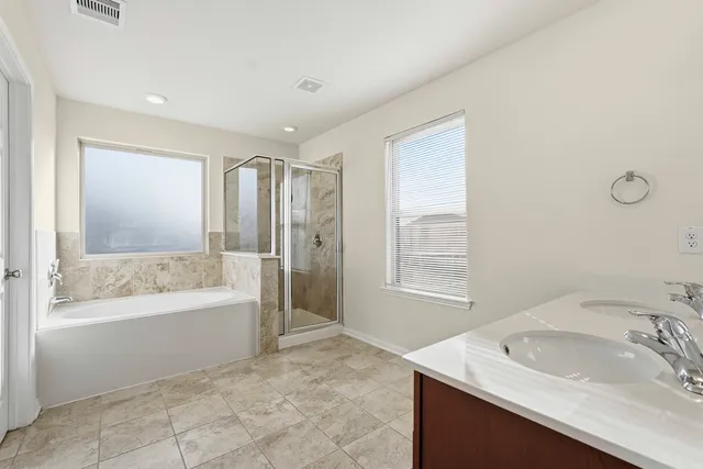 a bathroom with a bathtub and a sink