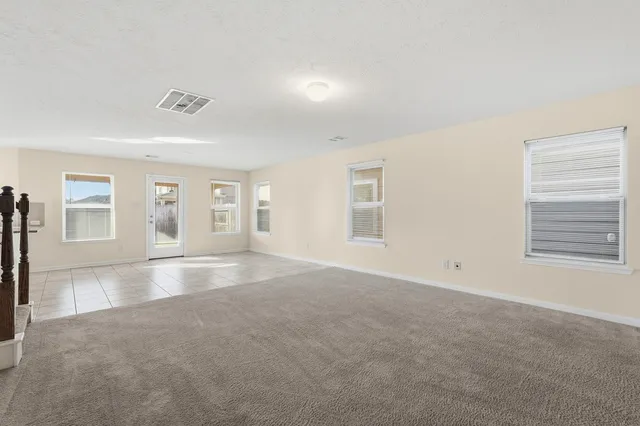 a view of empty room with windows