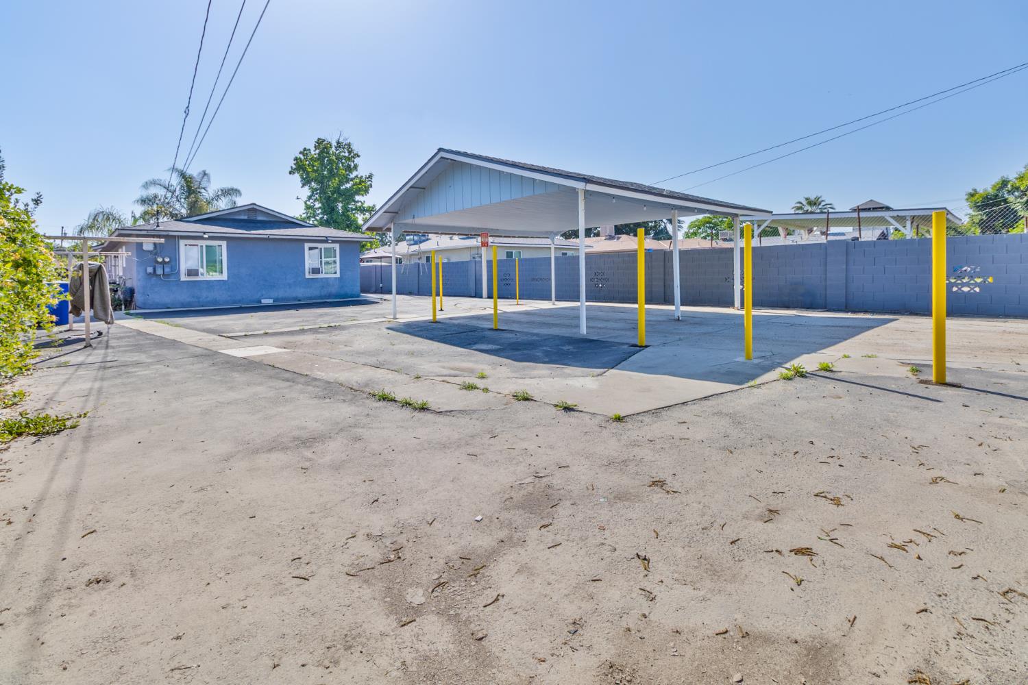 715 Faller Avenue Sanger, CA 93657 - Photo 12 of 40 a view of a house with a swimming pool