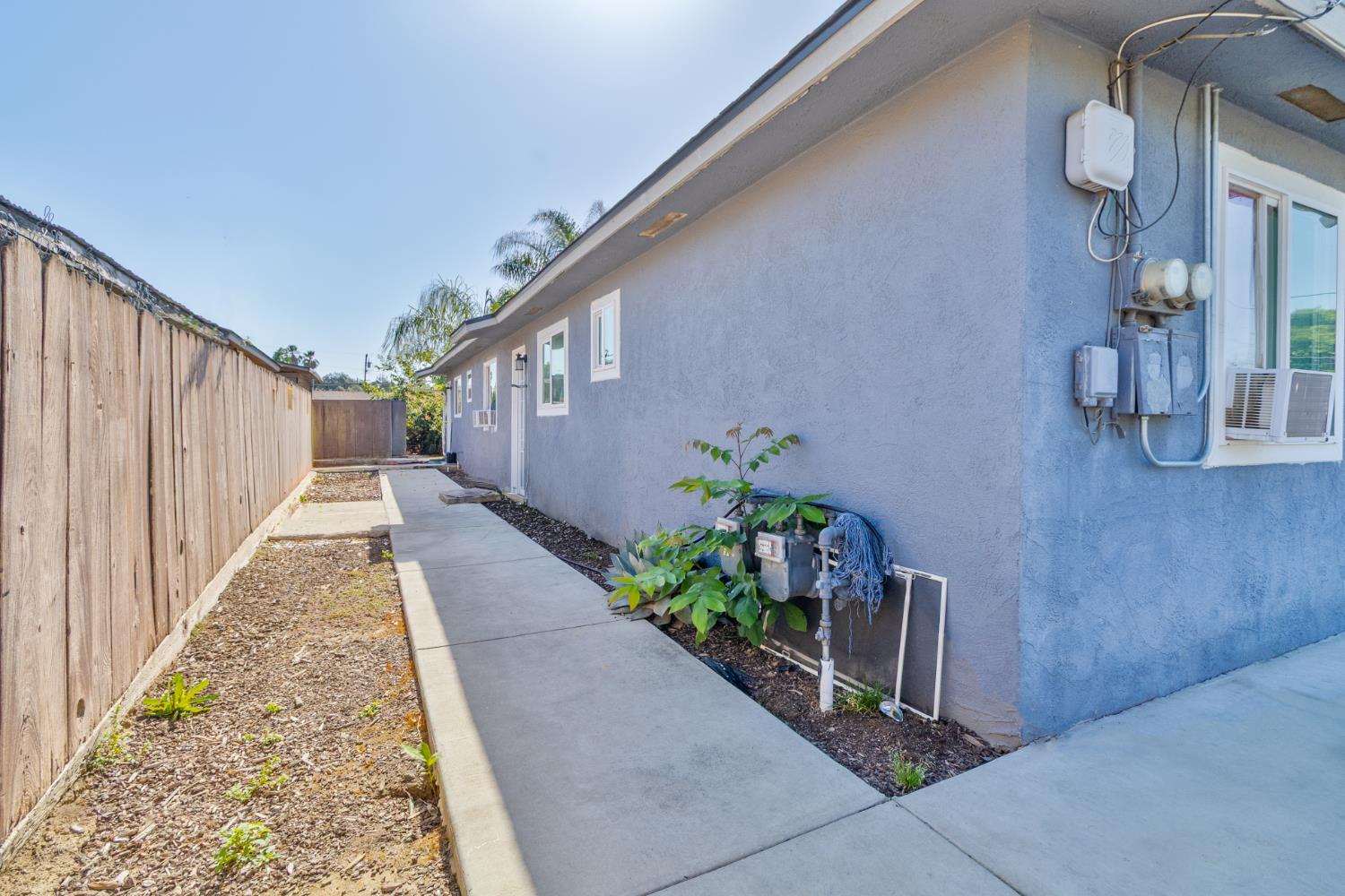 715 Faller Avenue Sanger, CA 93657 - Photo 15 of 40 a view of a pathway of a building