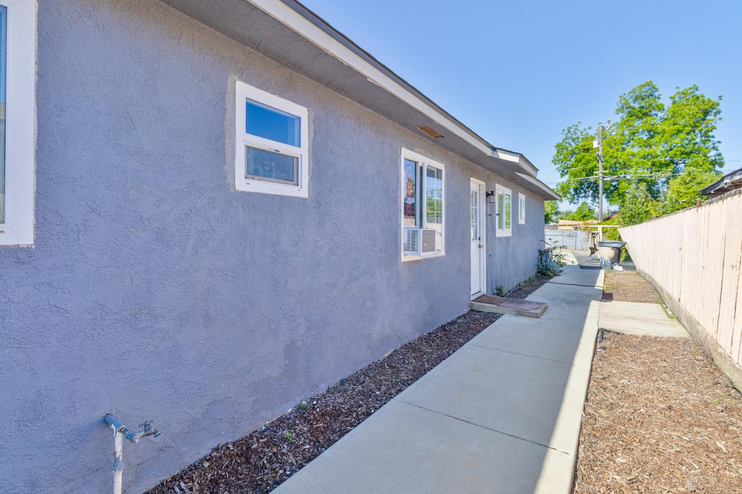 715 Faller Avenue Sanger, CA 93657 - Photo 16 of 40 a view of a house with a backyard