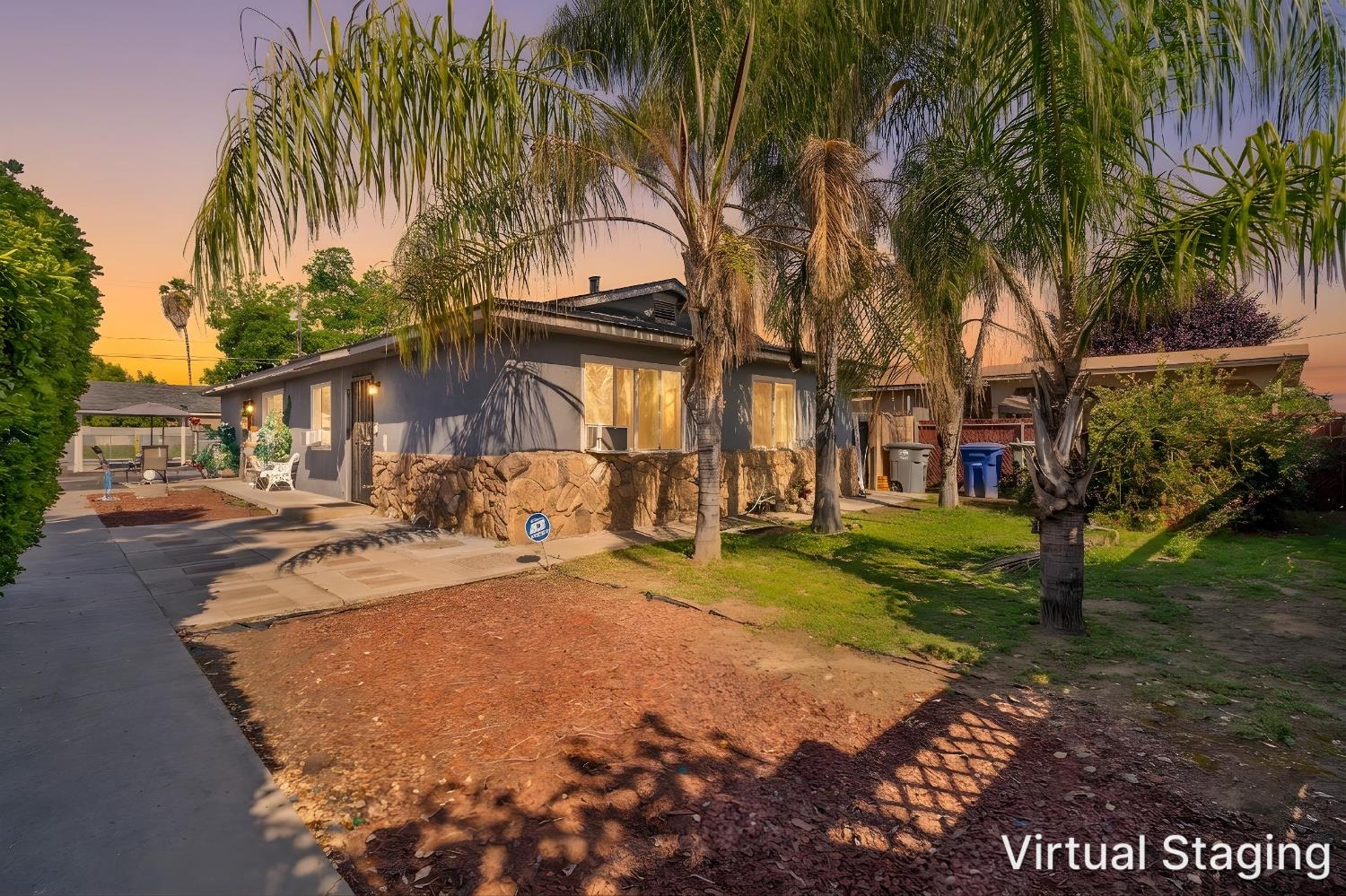 715 Faller Avenue Sanger, CA 93657 - Photo 2 of 40 a row of palm trees in front of house