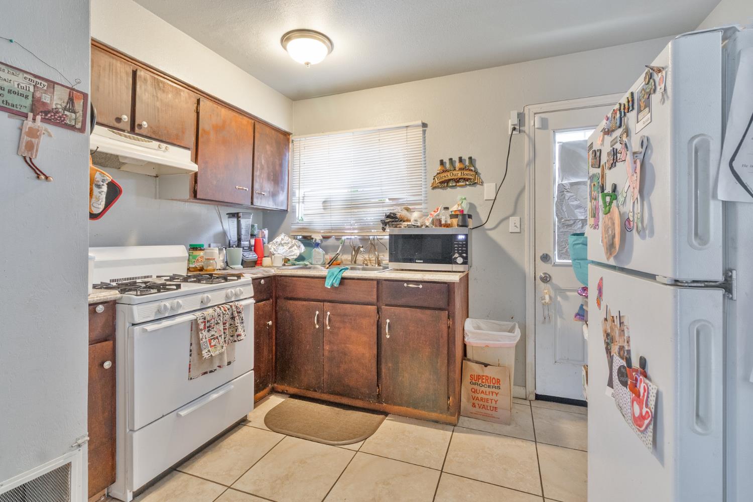 715 Faller Avenue Sanger, CA 93657 - Photo 28 of 40 a kitchen with stainless steel appliances granite countertop a refrigerator and a stove