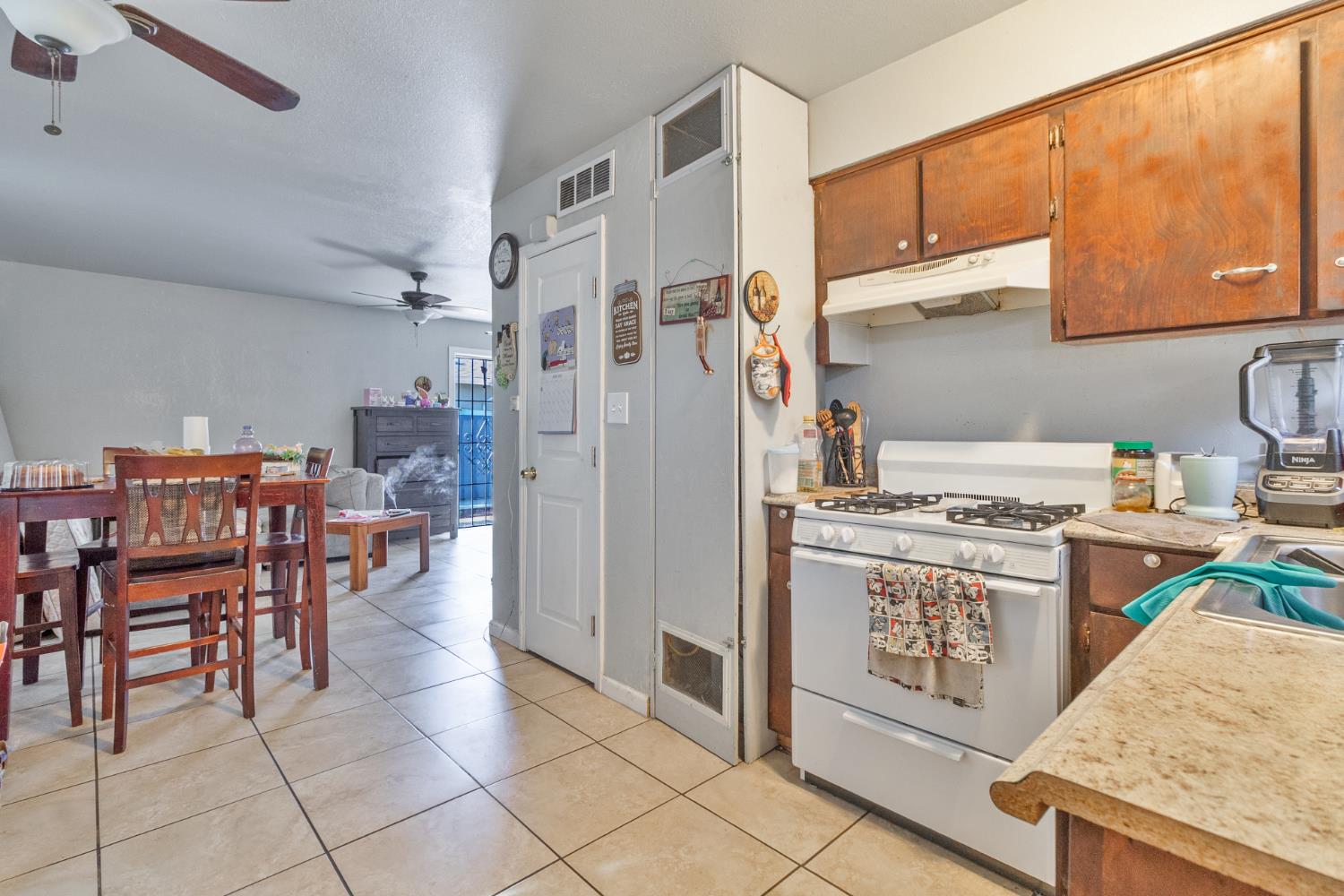 715 Faller Avenue Sanger, CA 93657 - Photo 30 of 40 a kitchen with appliances cabinets and a counter top space