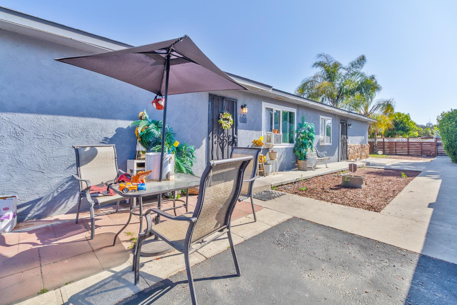 715 Faller Avenue Sanger, CA 93657 - Photo 4 of 40 a view of a house with backyard and sitting area
