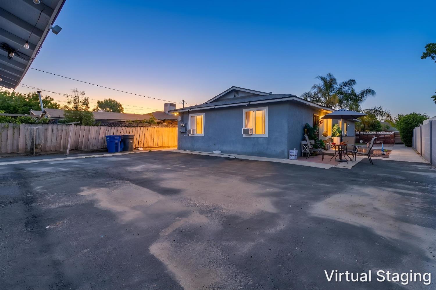715 Faller Avenue Sanger, CA 93657 - Photo 6 of 40 a view of a house with a yard and a fence