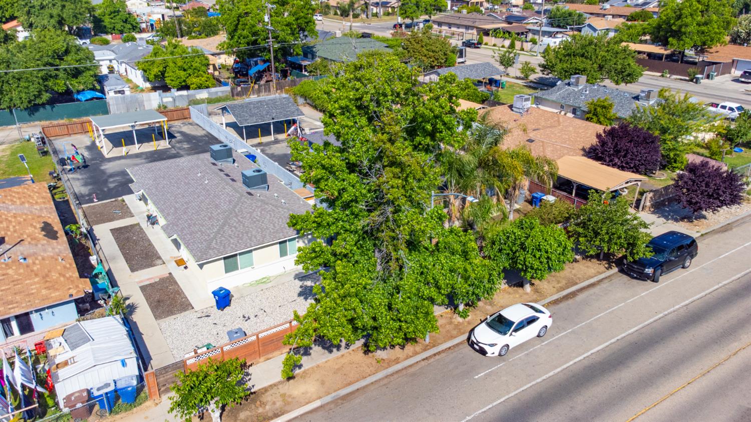 715 Faller Avenue Sanger, CA 93657 - Photo 9 of 40 an aerial view of a house with a yard and garden