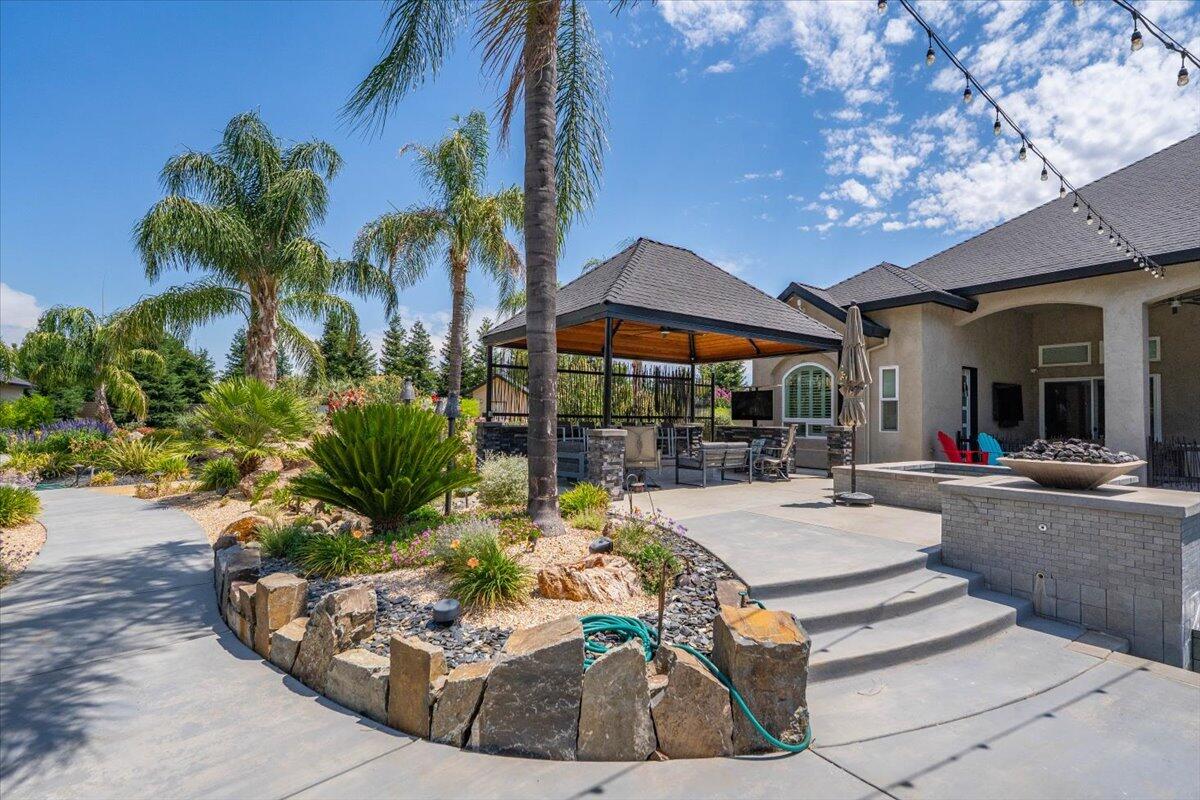 19580 Mockingbird Lane Redding, CA 96002 - Photo 136 of 216 a view of a backyard with plants and patio