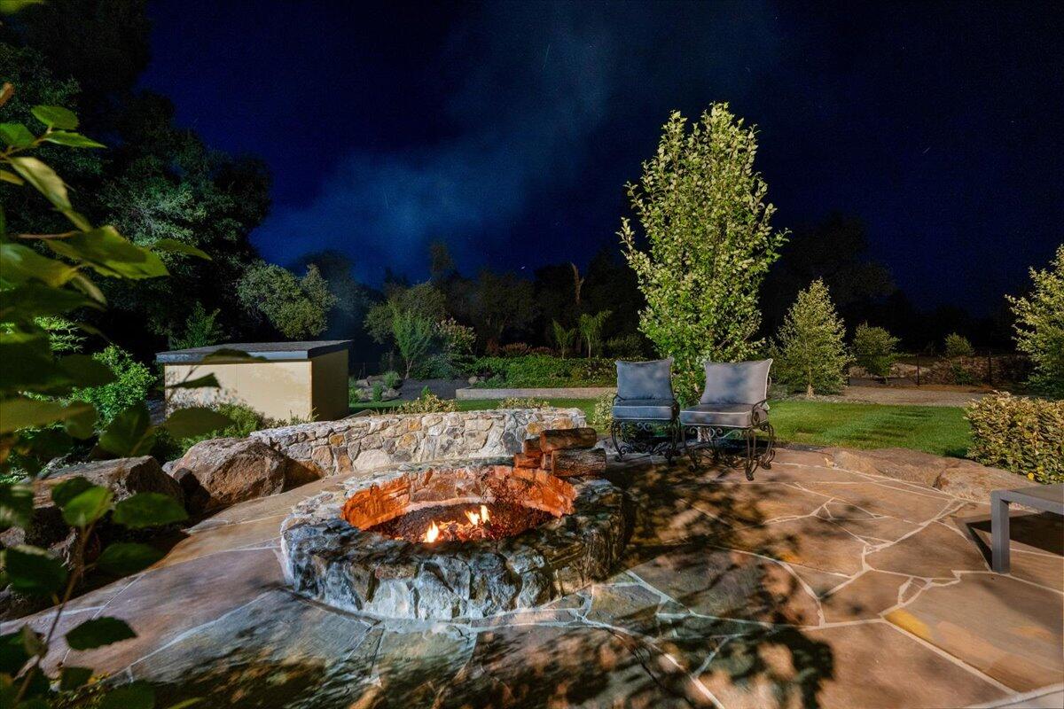 19580 Mockingbird Lane Redding, CA 96002 - Photo 202 of 216 a backyard of a house with lots of green space and outdoor seating