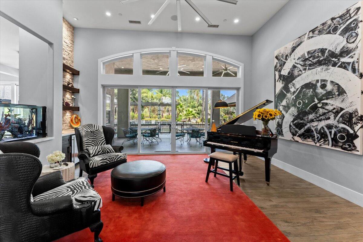 19580 Mockingbird Lane Redding, CA 96002 - Photo 40 of 216 a living room with furniture and a floor to ceiling window