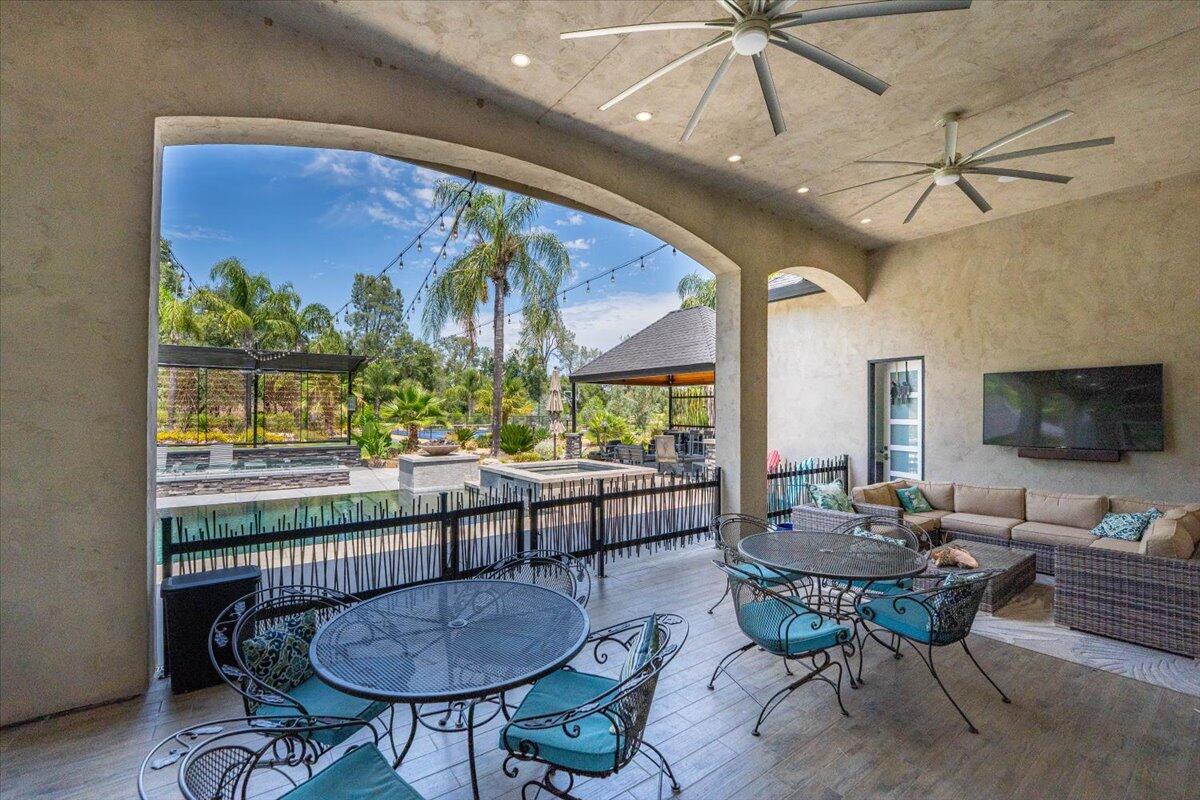 19580 Mockingbird Lane Redding, CA 96002 - Photo 53 of 216 a living room with furniture a flat screen tv and a large window