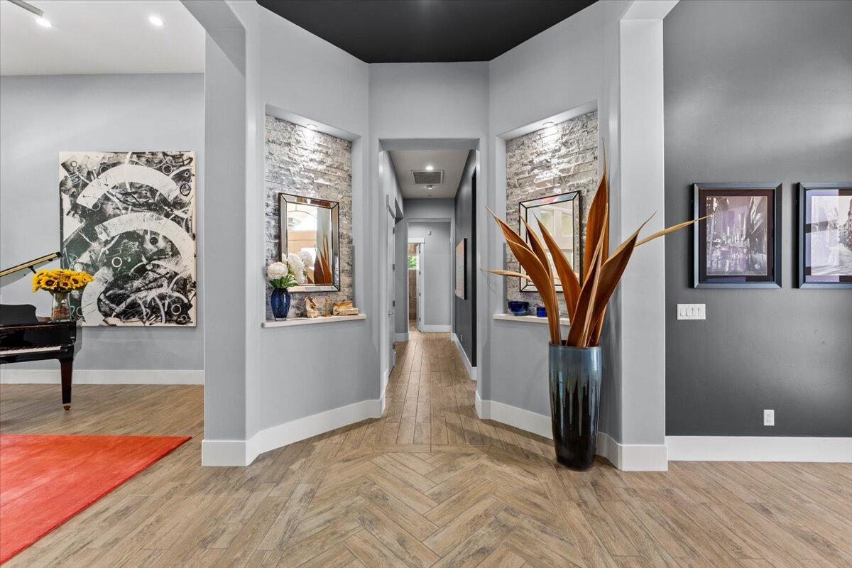 19580 Mockingbird Lane Redding, CA 96002 - Photo 59 of 216 a view of a hallway with wooden floor and windows