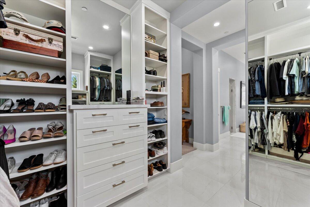 19580 Mockingbird Lane Redding, CA 96002 - Photo 85 of 216 a view of walk in closet with clothes and shoes