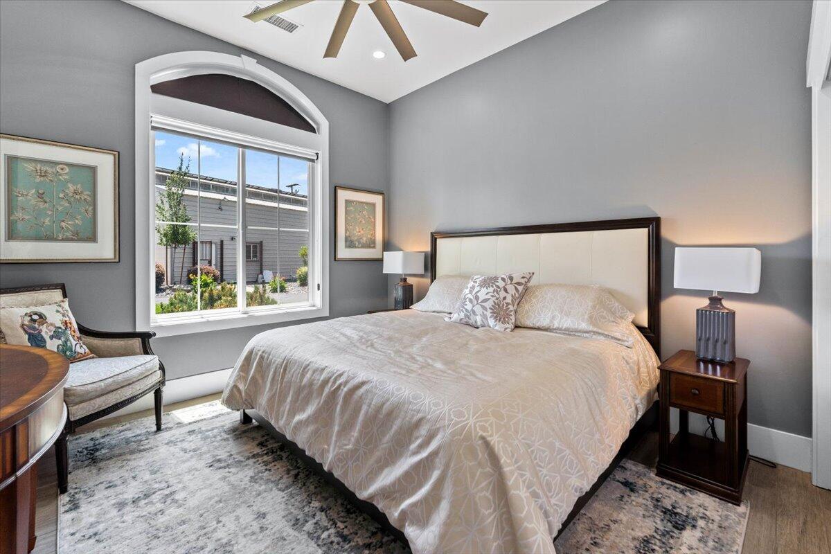 19580 Mockingbird Lane Redding, CA 96002 - Photo 94 of 216 a bedroom with a bed and wooden floor