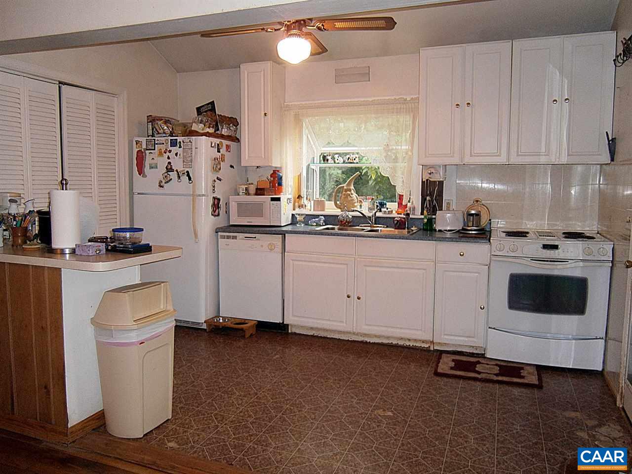 4280 Slam Gate Road Crozet, VA 22932 - Photo 5 of 20 a kitchen with white cabinets and white appliances