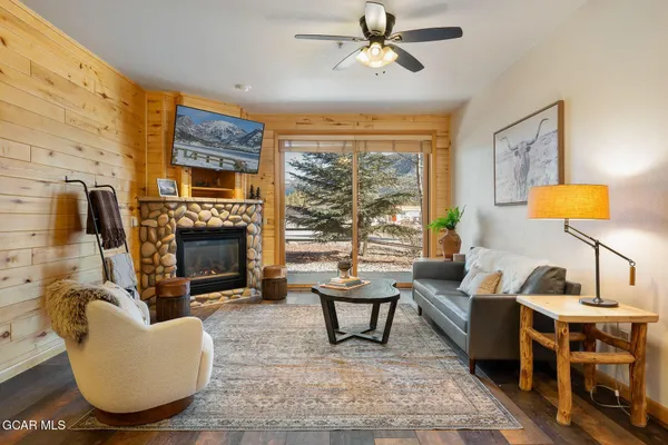 a living room with furniture and a fireplace