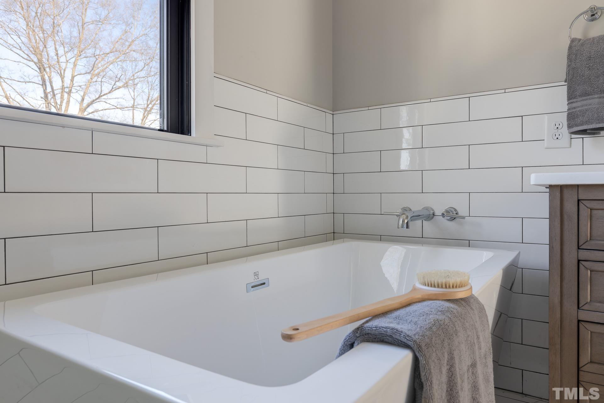 1010 Onslow Street Durham, NC 27705 - Photo 24 of 30 a bathroom with a tub and a window