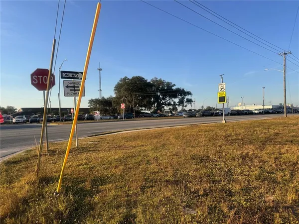 a view of an ocean with palm trees
