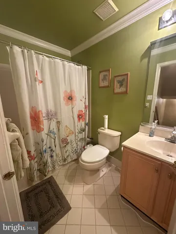 a bathroom with a toilet a sink and a shower