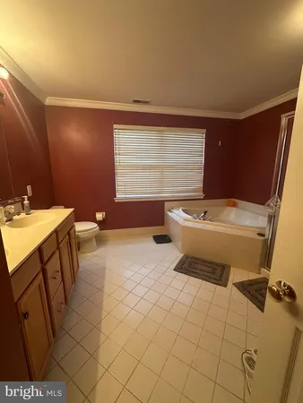 a bathroom with a sink toilet and mirror