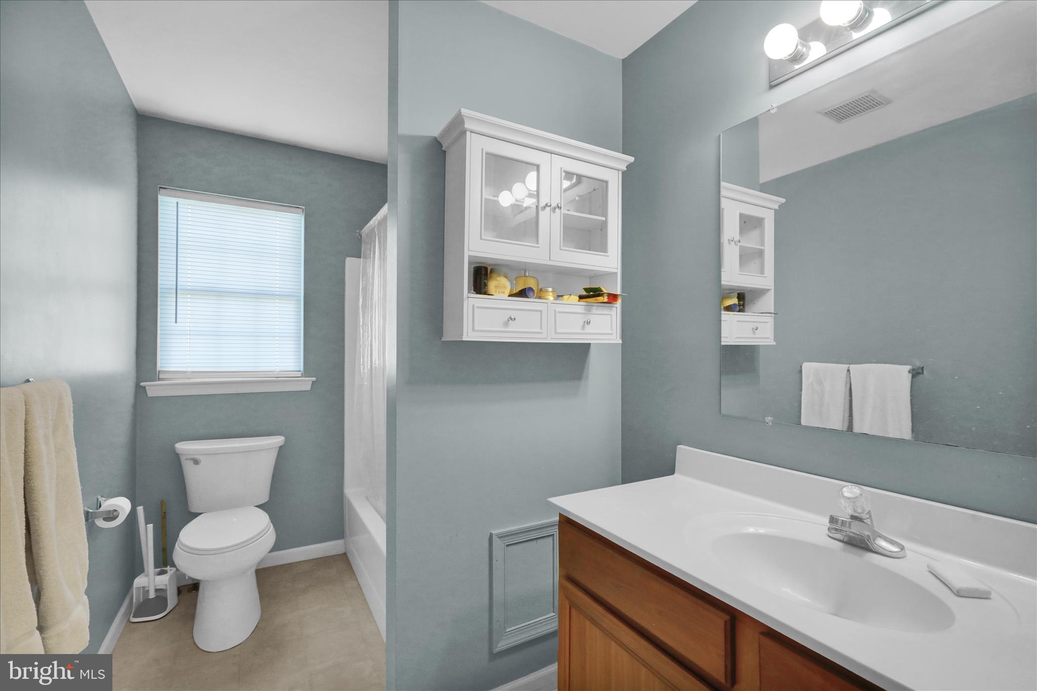 18 Bowes Lane Reading, PA 19606 - Photo 16 of 34 a bathroom with a toilet sink and mirror