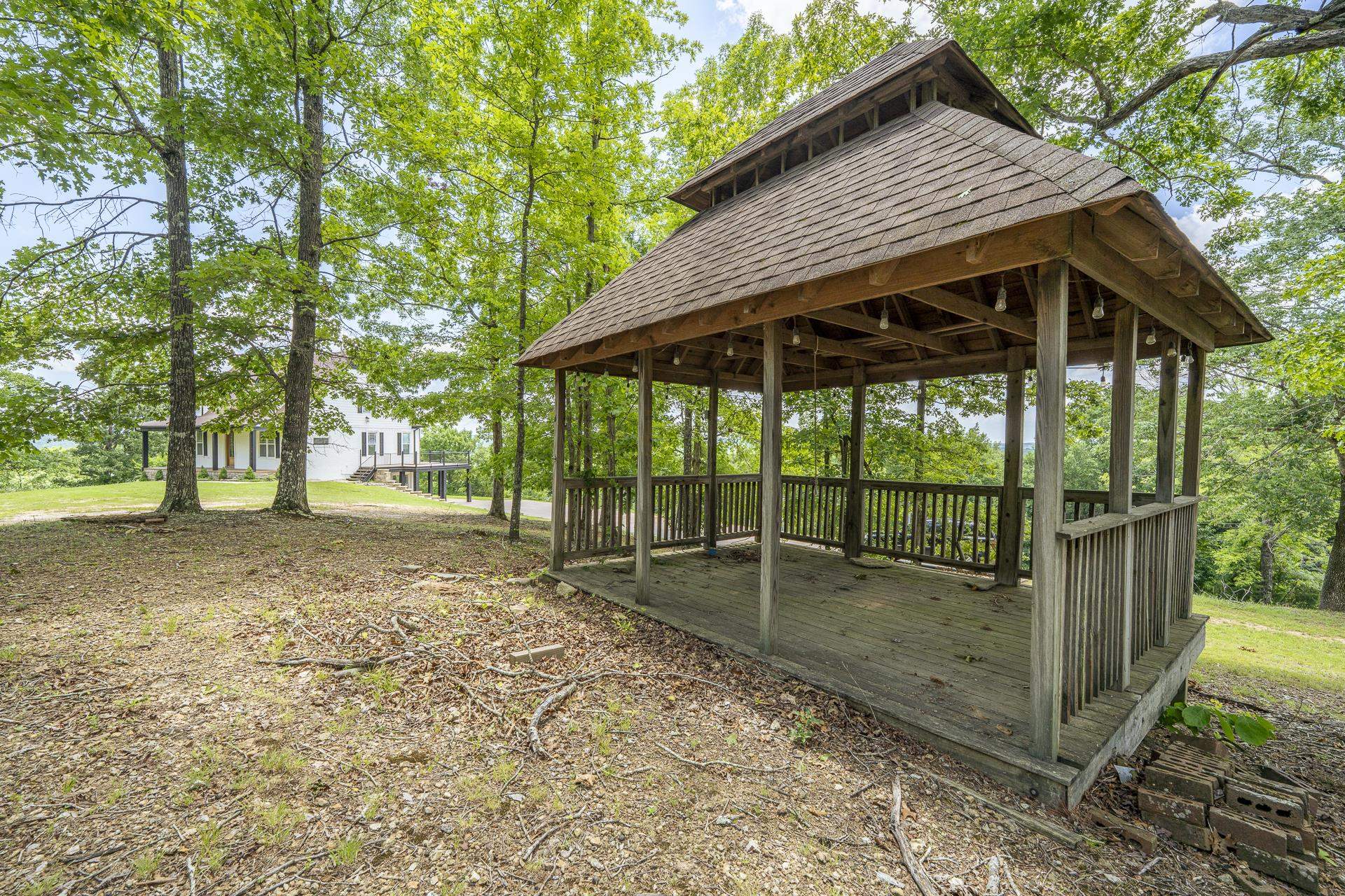 851 Rivers Edge Drive Bath Springs, TN 38311 - Photo 34 of 39 Freestanding gazebo featuring a multi-tiered roof, wood-finish decking, and open-air wood railing