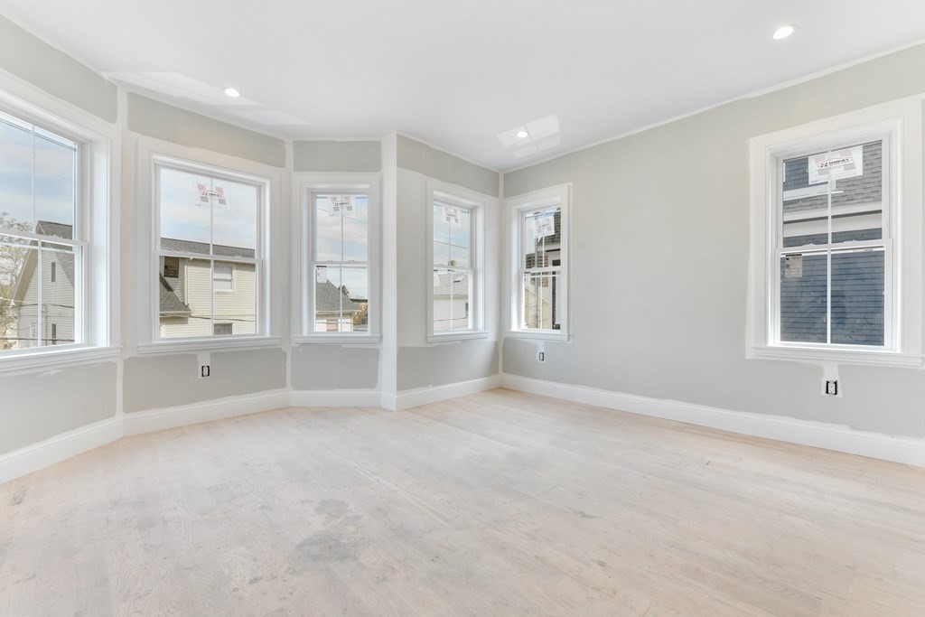 12 Ennis Road, Unit REAR Boston, MA 02119 - Photo 14 of 26 a view of an empty room with a window