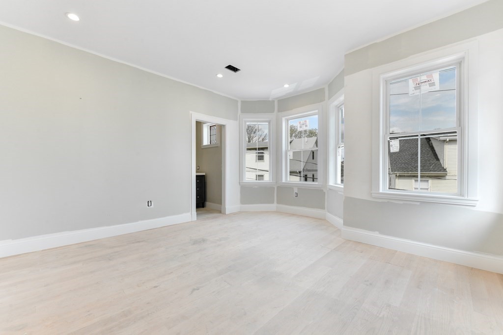 12 Ennis Road, Unit REAR Boston, MA 02119 - Photo 15 of 26 a view of an empty room with a window