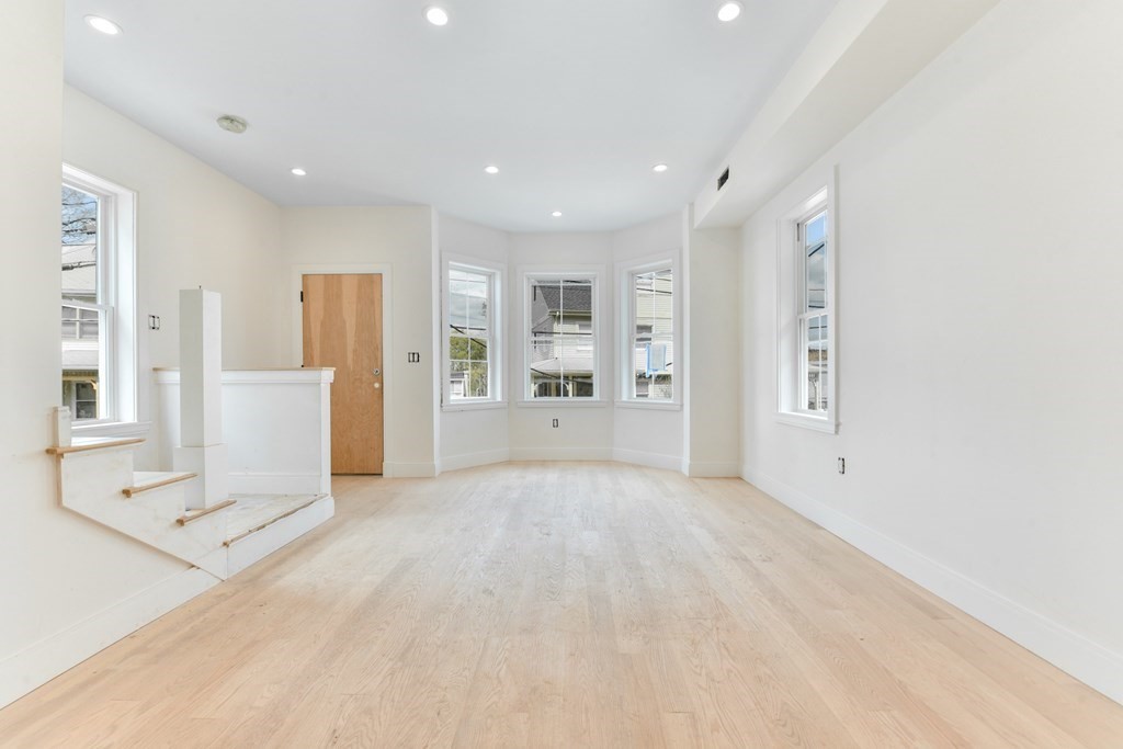 12 Ennis Road, Unit REAR Boston, MA 02119 - Photo 2 of 26 a view of an empty room with a window
