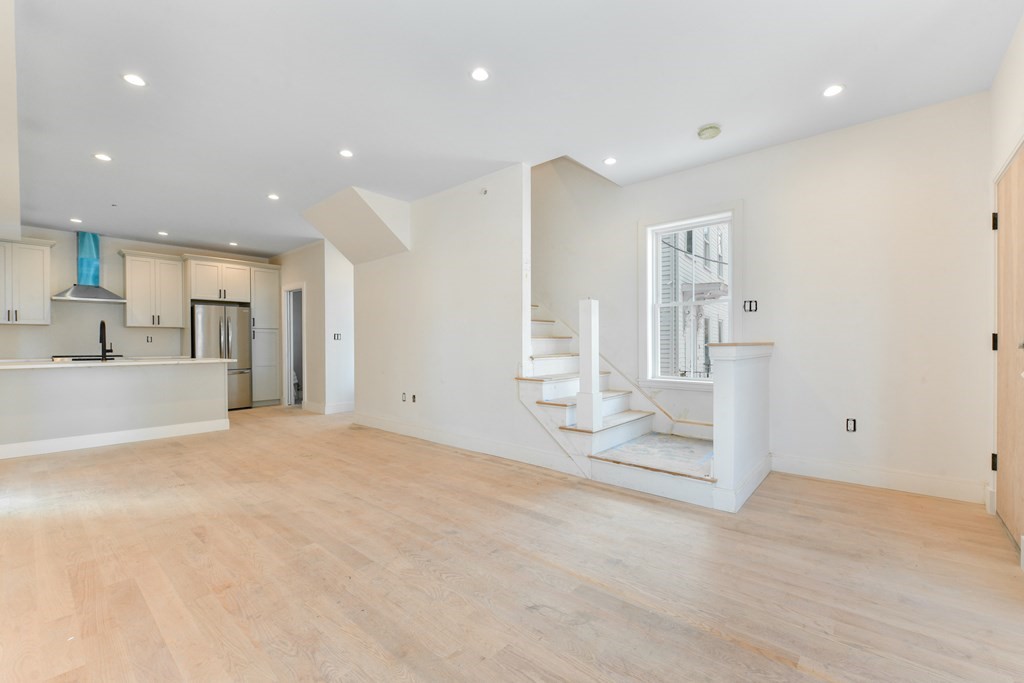 12 Ennis Road, Unit REAR Boston, MA 02119 - Photo 6 of 26 a view of a kitchen with large windows