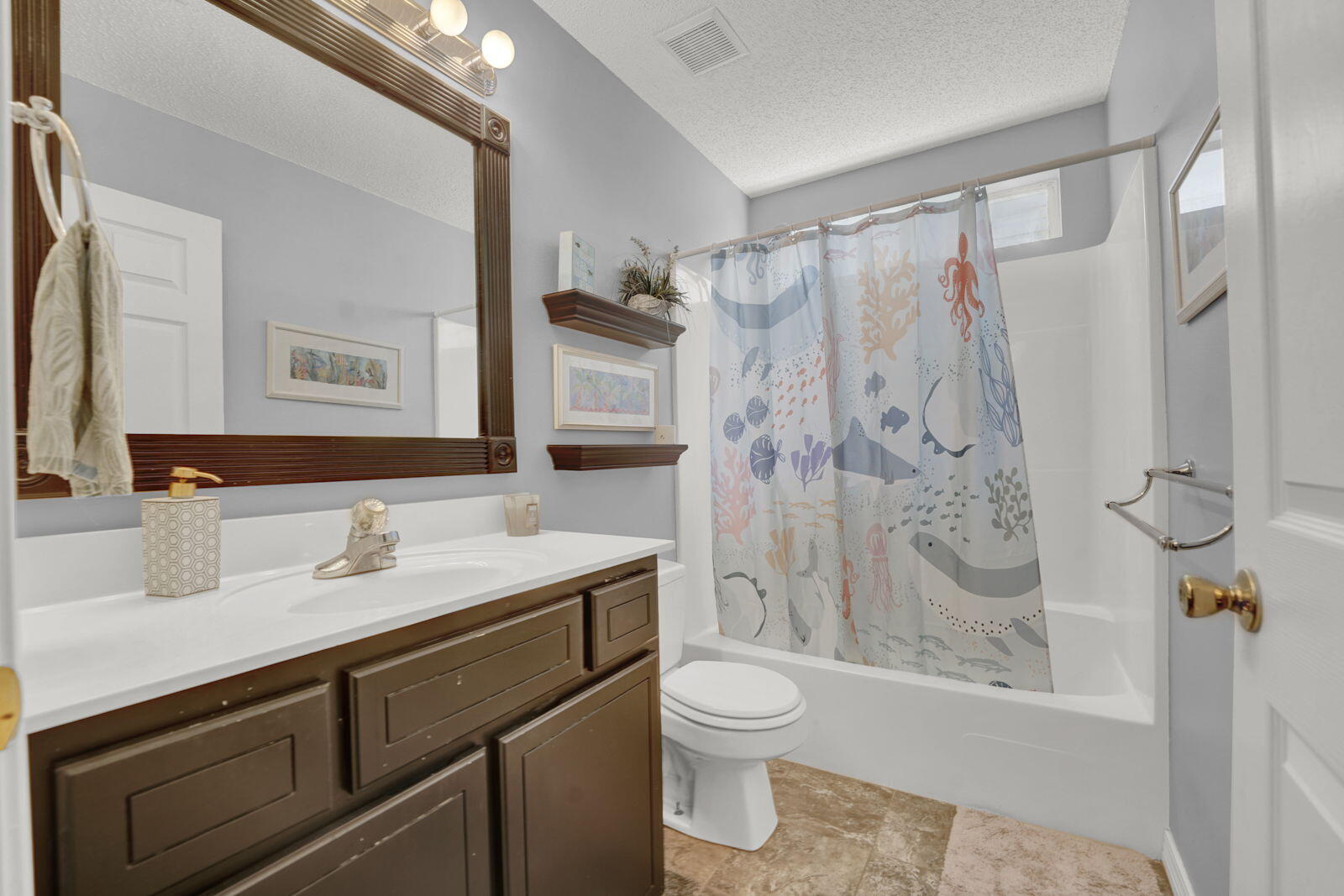 231 Vía Largo, Unit 39B Santa Rosa Beach, FL 32459 - Photo 14 of 50 a bathroom with a sink and a mirror