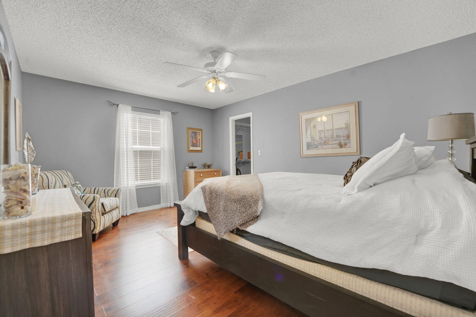 231 Vía Largo, Unit 39B Santa Rosa Beach, FL 32459 - Photo 15 of 50 a bedroom with a bed and wooden floor