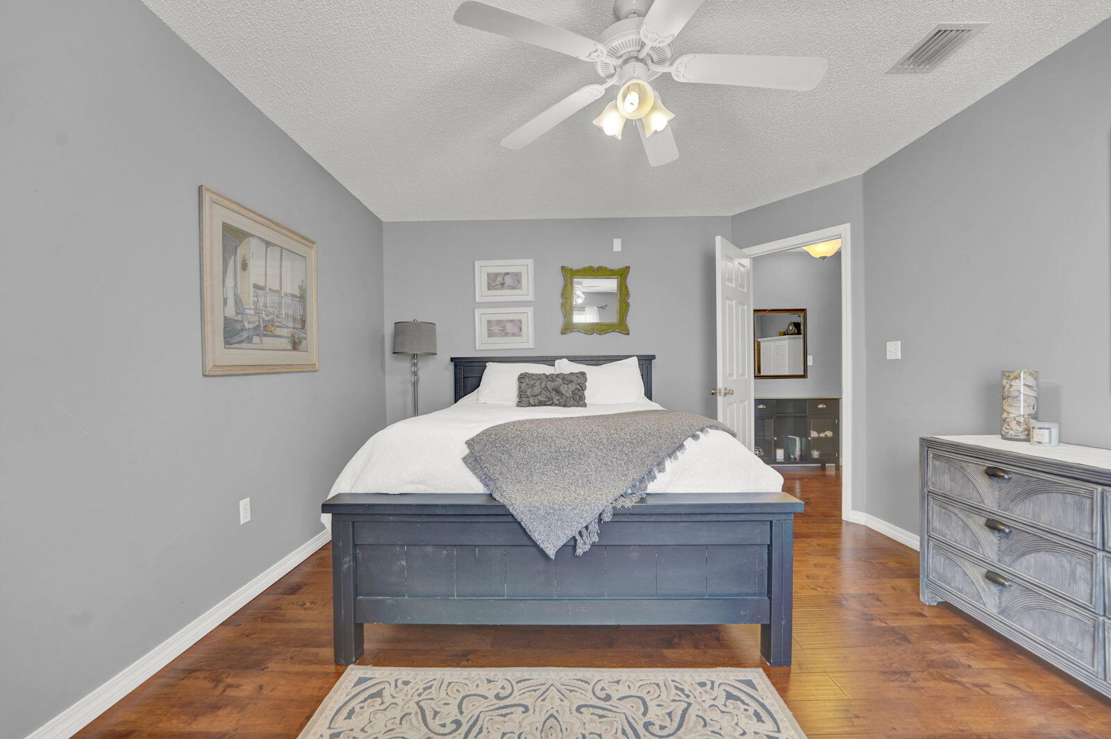 231 Vía Largo, Unit 39B Santa Rosa Beach, FL 32459 - Photo 17 of 50 a spacious bedroom with a large bed and a chandelier