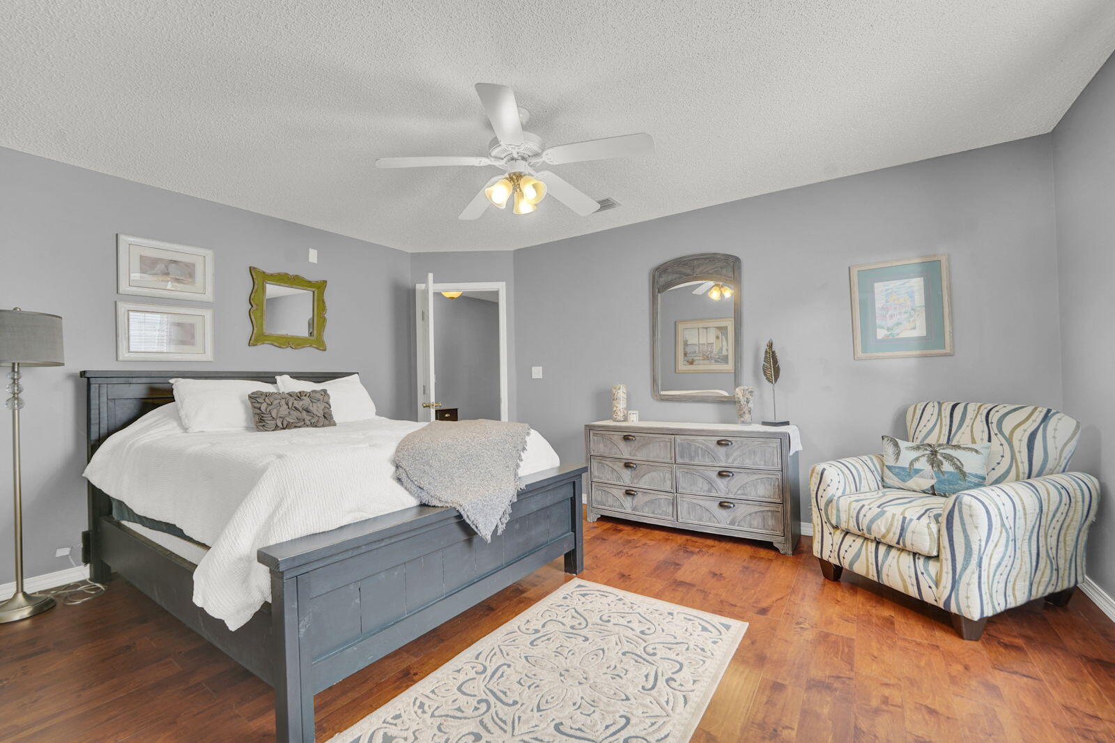 231 Vía Largo, Unit 39B Santa Rosa Beach, FL 32459 - Photo 18 of 50 a spacious bedroom with a bed and a couch