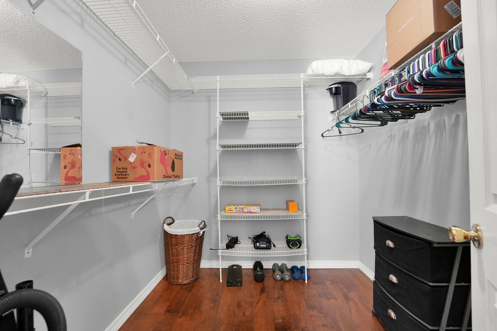 231 Vía Largo, Unit 39B Santa Rosa Beach, FL 32459 - Photo 19 of 50 a kitchen with stainless steel appliances cabinets and wooden floor