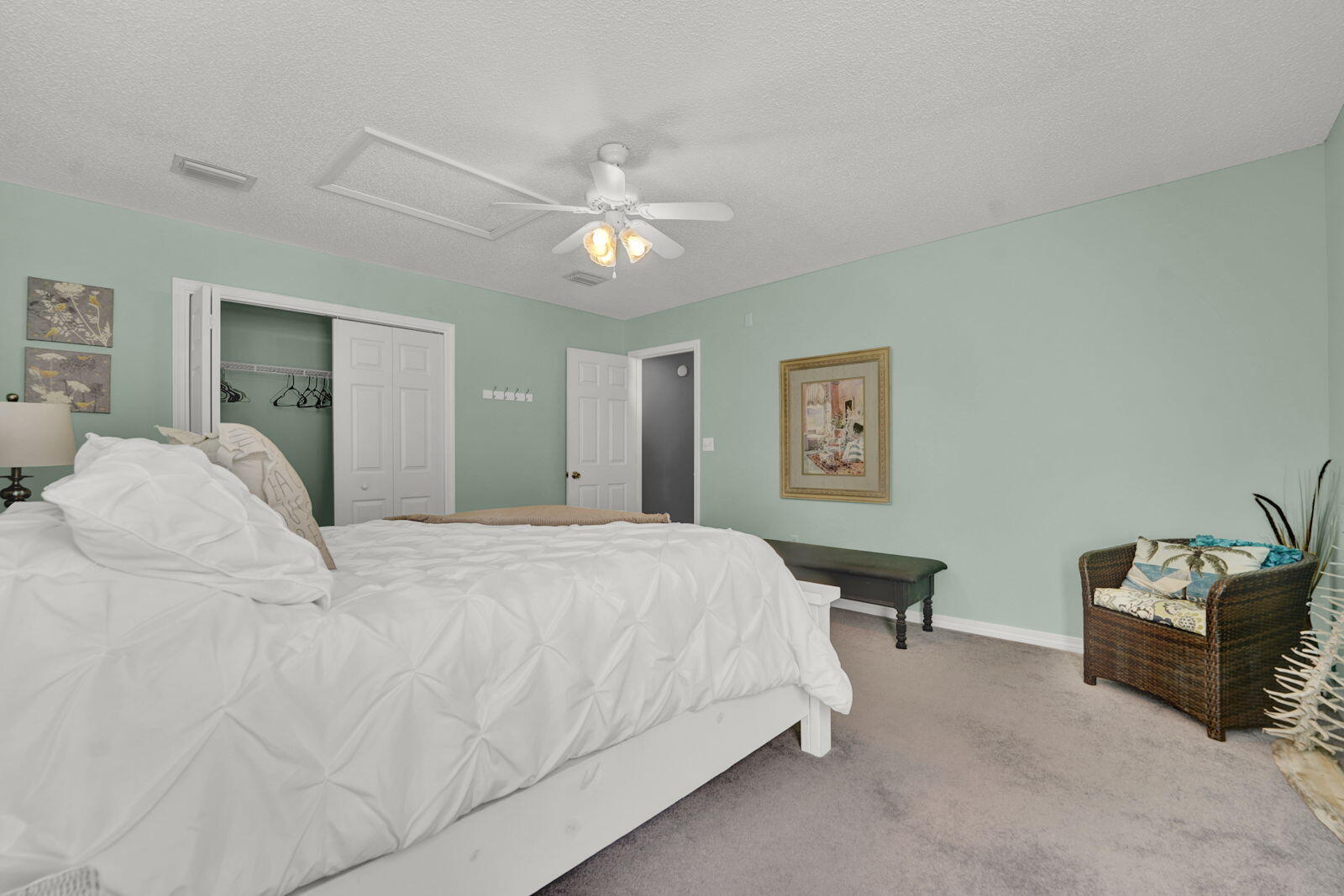 231 Vía Largo, Unit 39B Santa Rosa Beach, FL 32459 - Photo 24 of 50 a bedroom with a bed and a chandelier