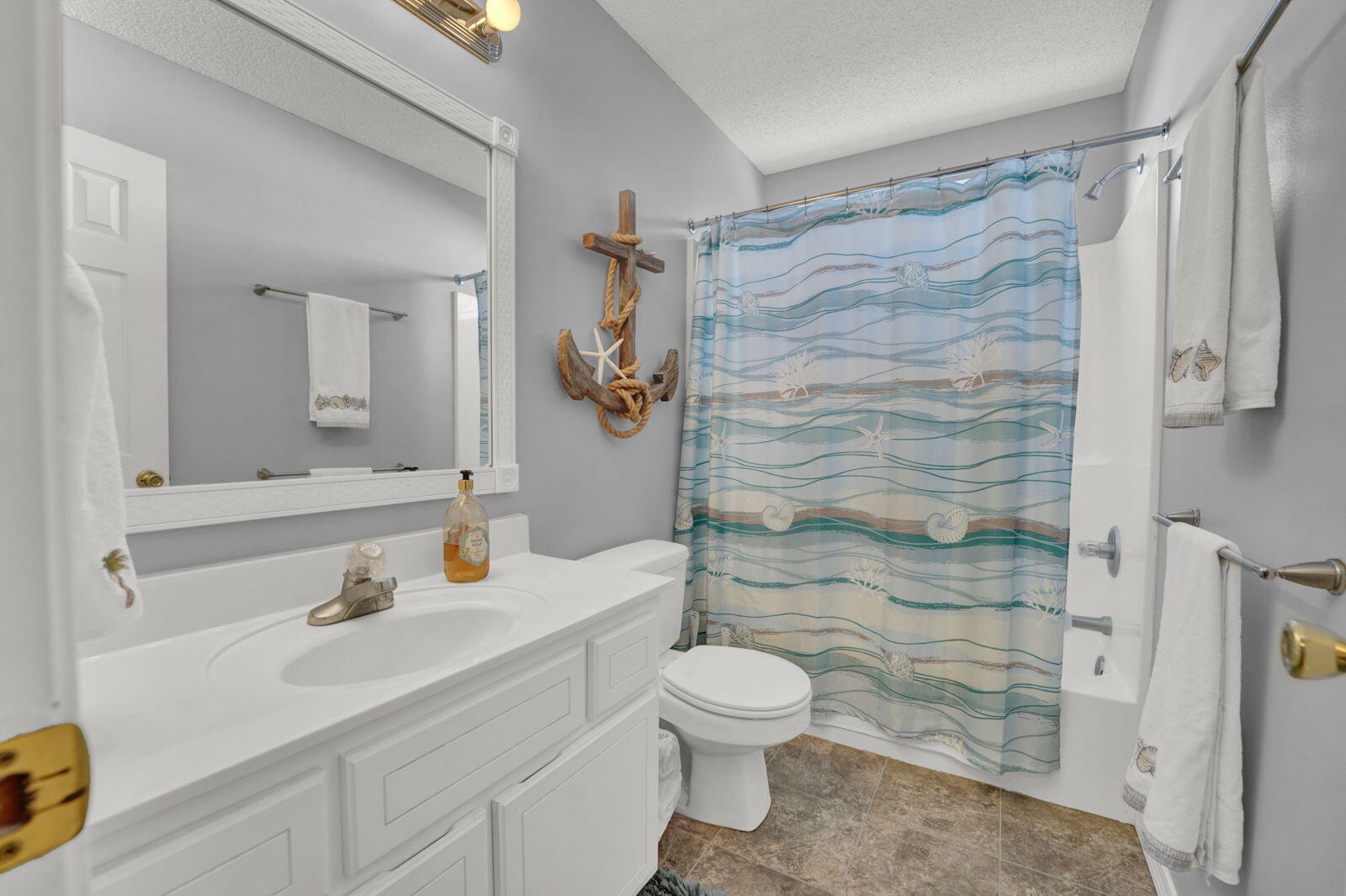231 Vía Largo, Unit 39B Santa Rosa Beach, FL 32459 - Photo 26 of 50 a bathroom with a sink and a mirror