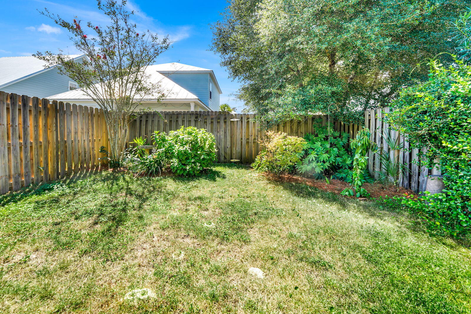 231 Vía Largo, Unit 39B Santa Rosa Beach, FL 32459 - Photo 30 of 50 a view of a large garden with a lake view