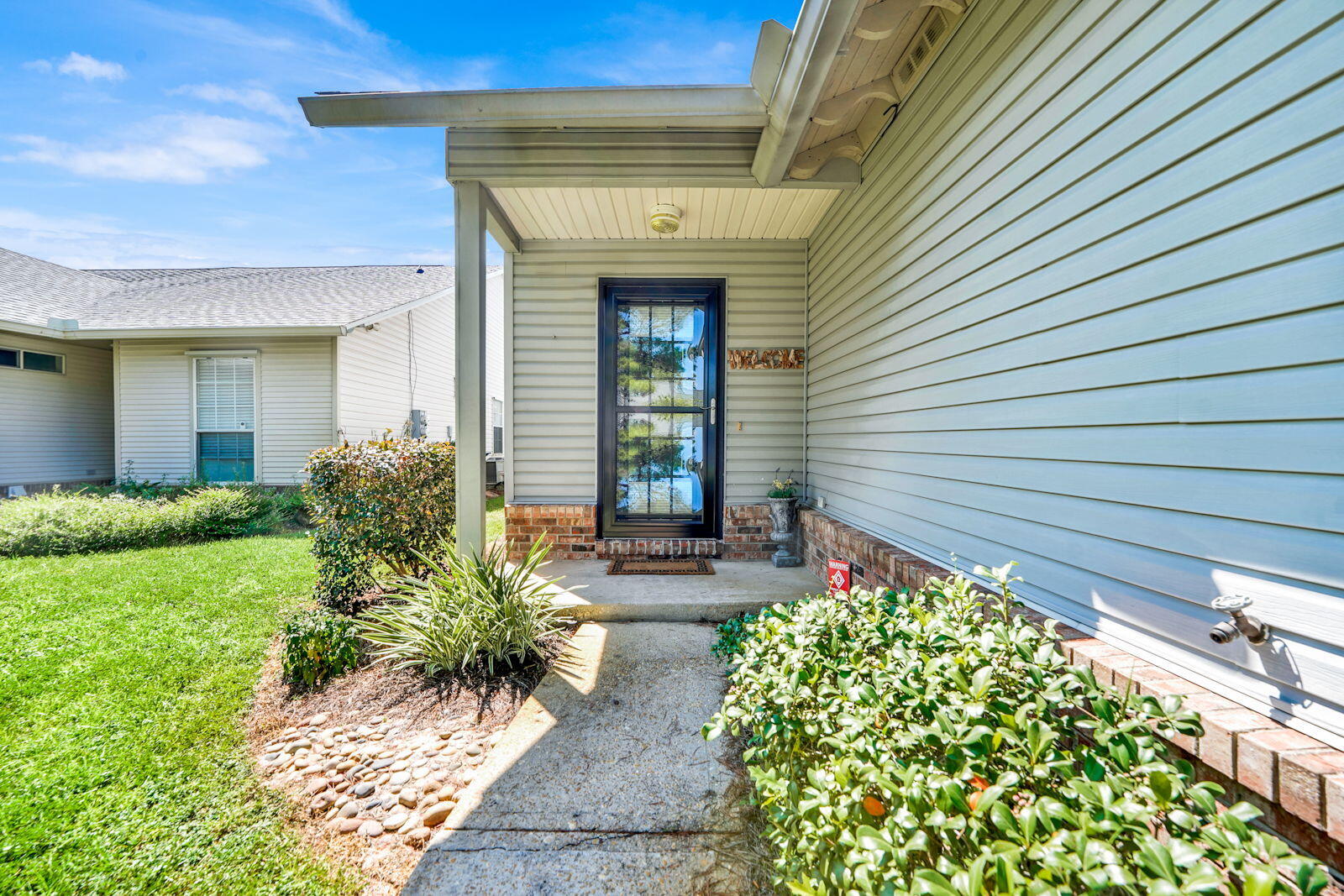 231 Vía Largo, Unit 39B Santa Rosa Beach, FL 32459 - Photo 31 of 50 a front view of a house with garden