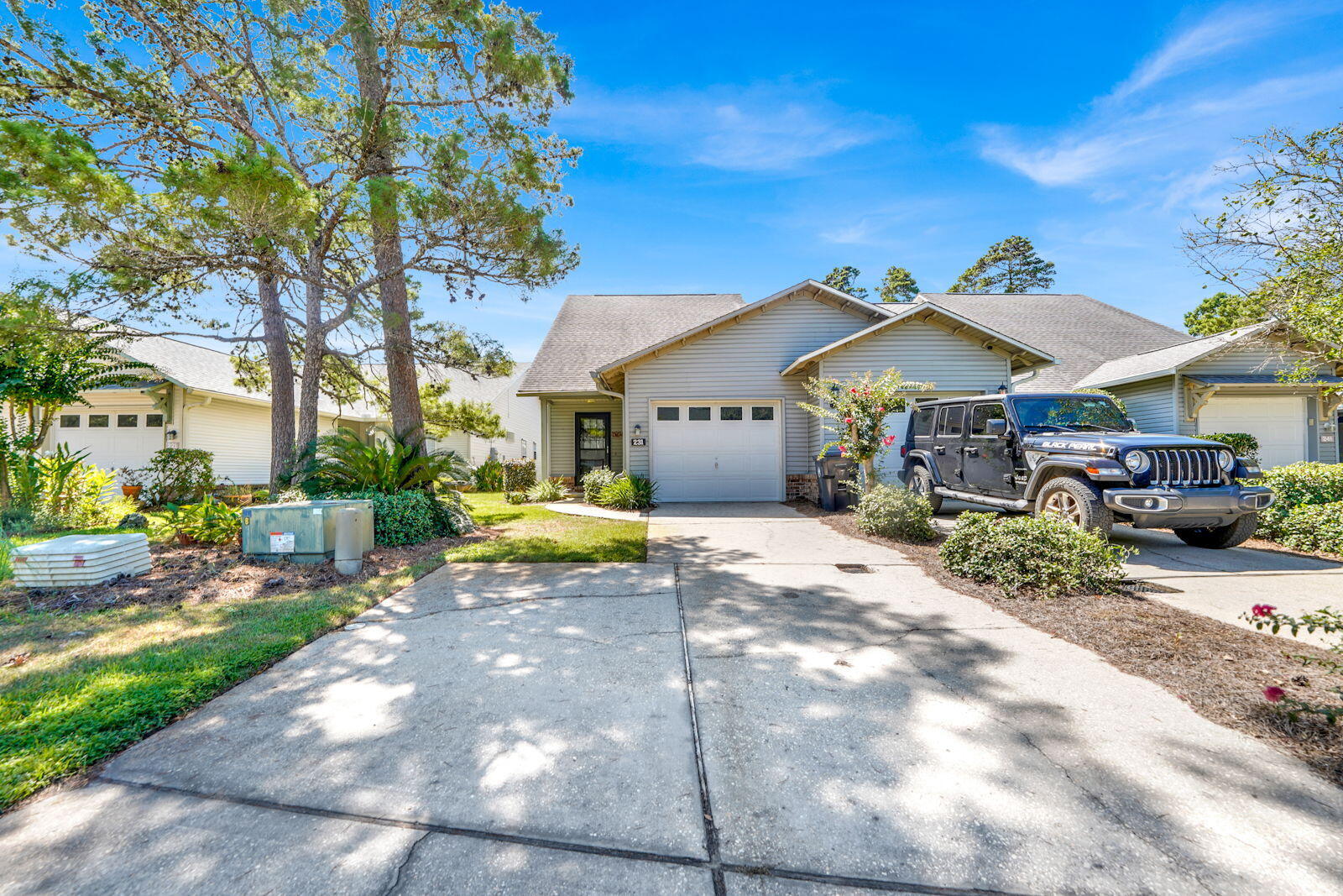 231 Vía Largo, Unit 39B Santa Rosa Beach, FL 32459 - Photo 32 of 50 a view of a house with backyard and sitting area