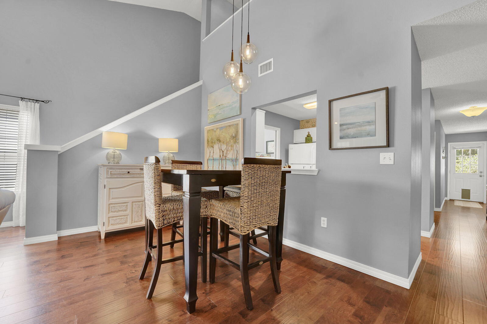 231 Vía Largo, Unit 39B Santa Rosa Beach, FL 32459 - Photo 5 of 50 a view of a dining room with furniture and wooden floor
