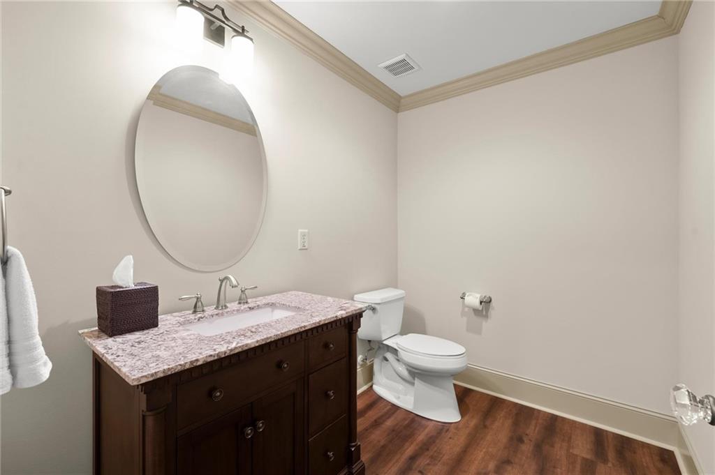 322 Edwards Brook Lane Canton, GA 30115 - Photo 72 of 99 a bathroom with a granite countertop sink a toilet and a mirror
