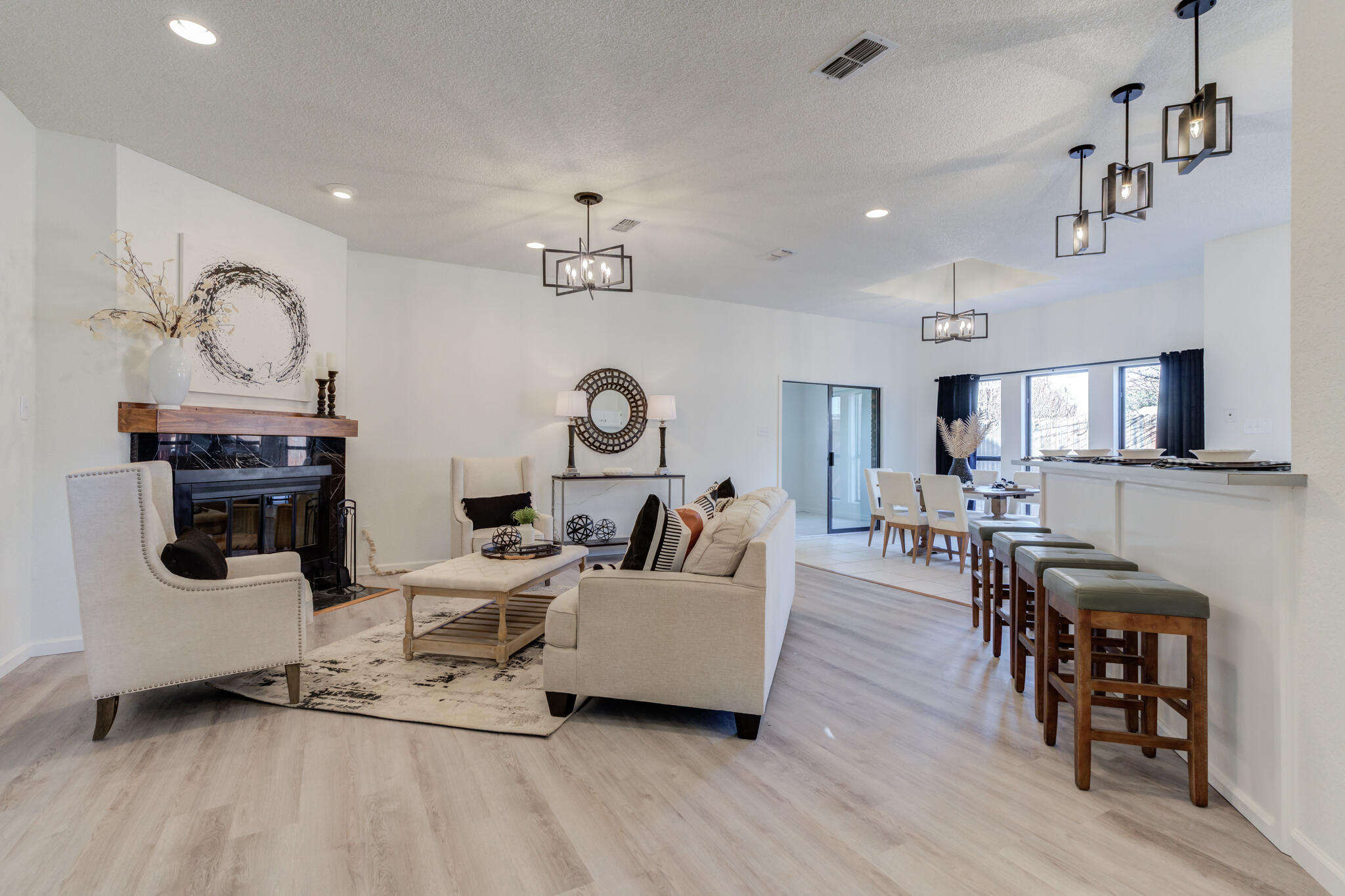 3602 101st Street Lubbock, TX 79423 - Photo 11 of 51 a living room with furniture and a wooden floor