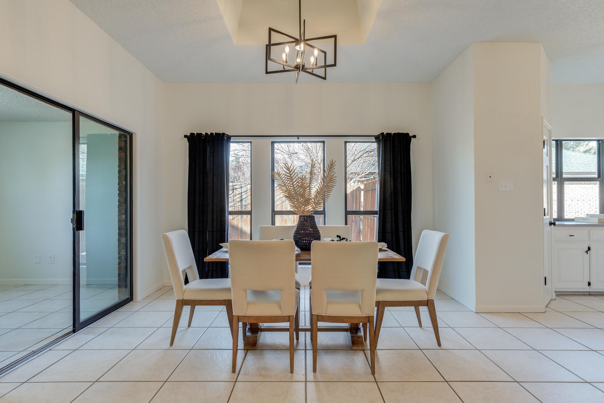 3602 101st Street Lubbock, TX 79423 - Photo 16 of 51 a view of a dining room with furniture window and outside view