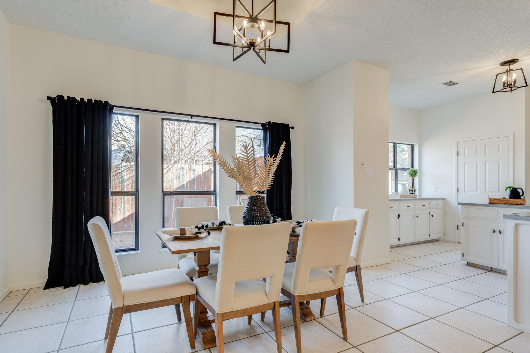 3602 101st Street Lubbock, TX 79423 - Photo 17 of 51 a view of a dining room with furniture window and outside view