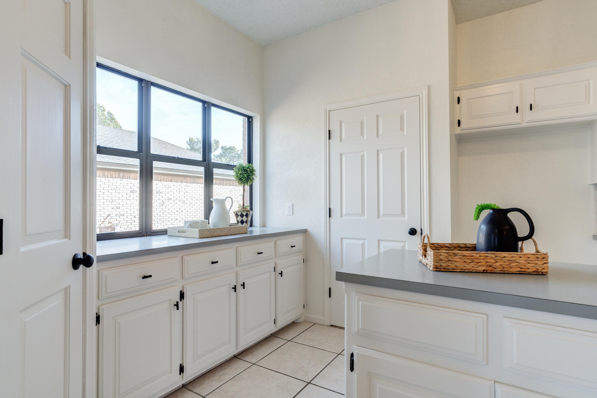 3602 101st Street Lubbock, TX 79423 - Photo 18 of 51 a kitchen with granite countertop white cabinets and a window