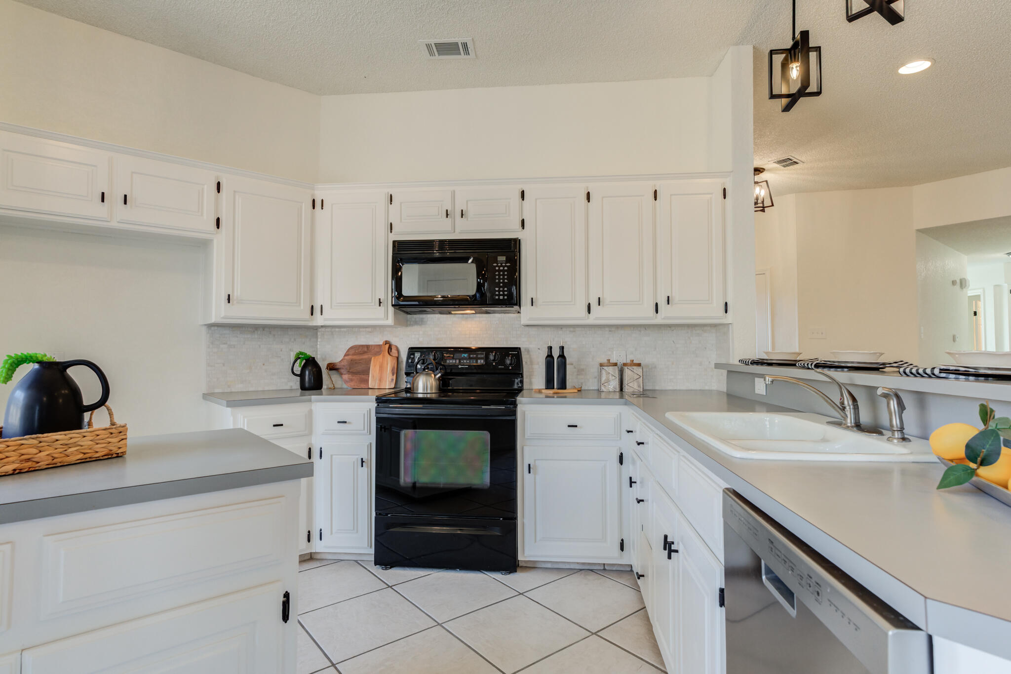 3602 101st Street Lubbock, TX 79423 - Photo 20 of 51 a kitchen with cabinets appliances and a sink
