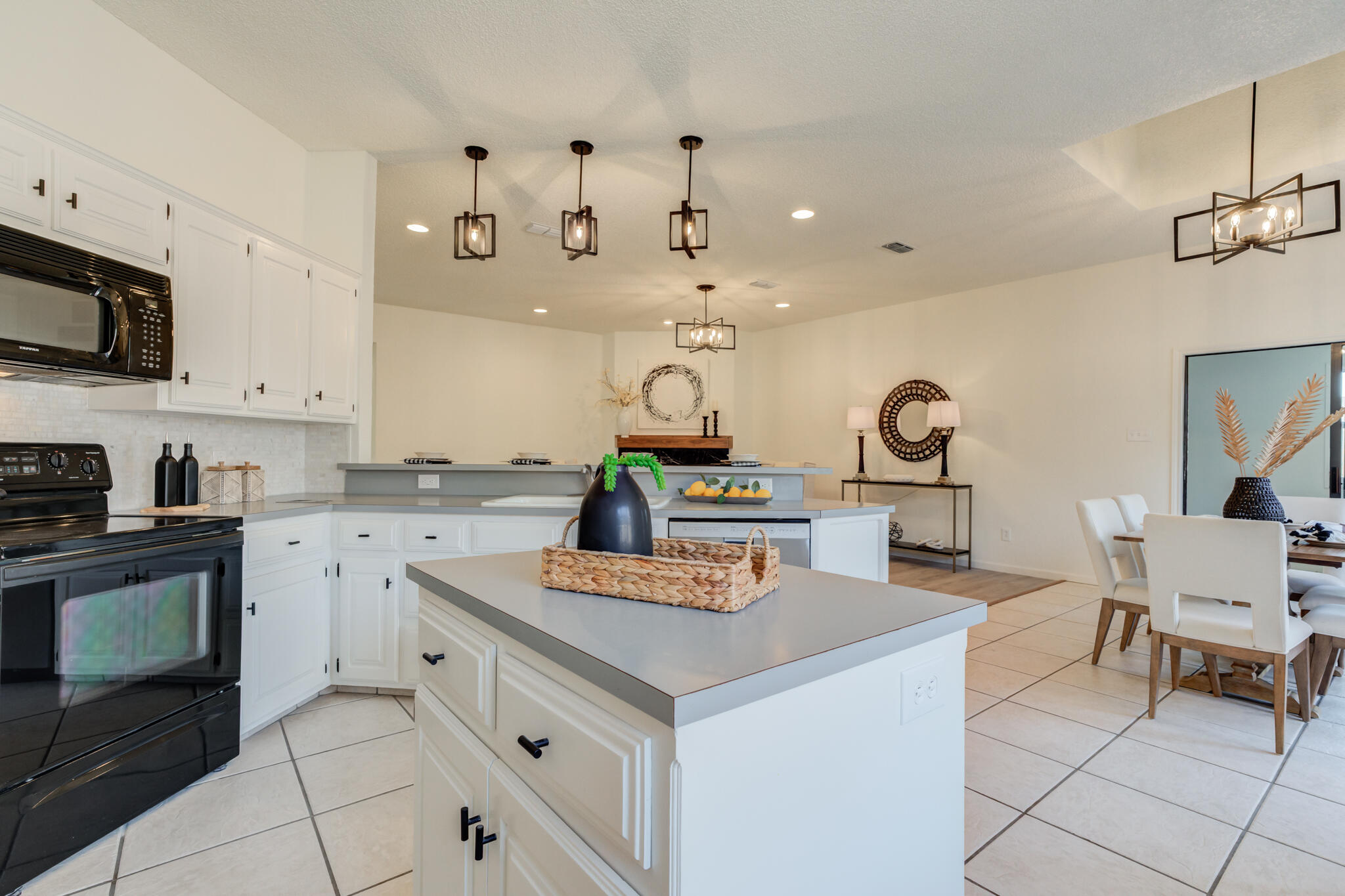 3602 101st Street Lubbock, TX 79423 - Photo 22 of 51 a kitchen with a stove cabinets and window