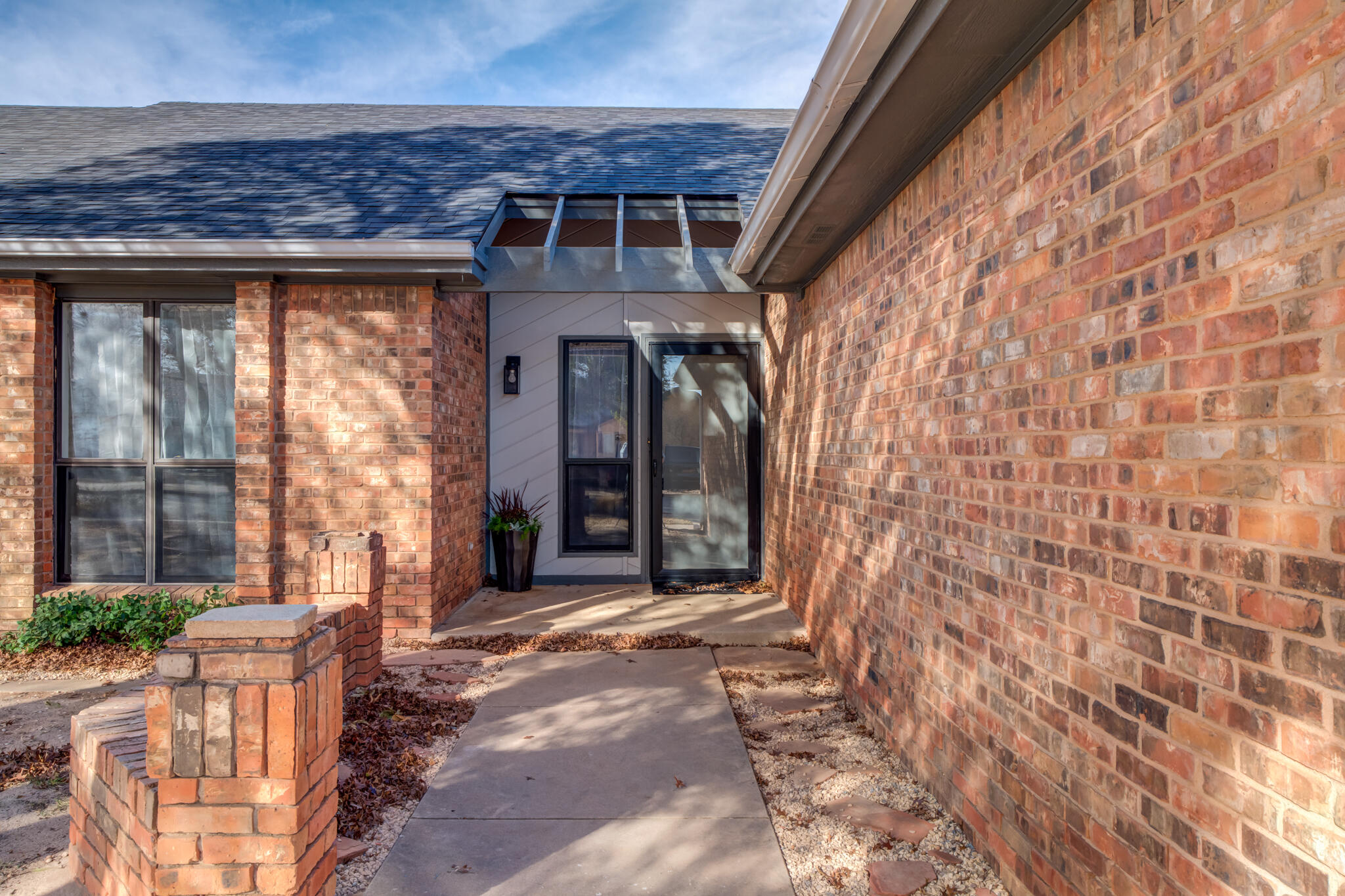 3602 101st Street Lubbock, TX 79423 - Photo 3 of 51 a front view of a house with a porch
